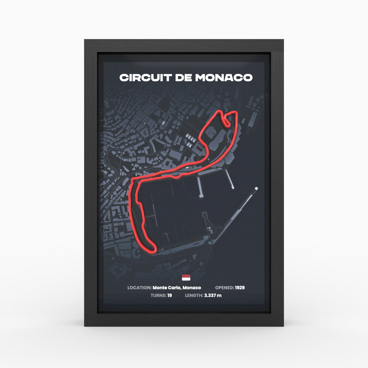Monaco race track as a 3D relief in a black wooden frame: red track on dark city map, front view