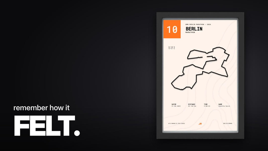 Text 'remember how it FELT.' above the Editorial Marathon Poster Berlin, front view, with raised black 3D track on cream background, orange race number field, and black frame.