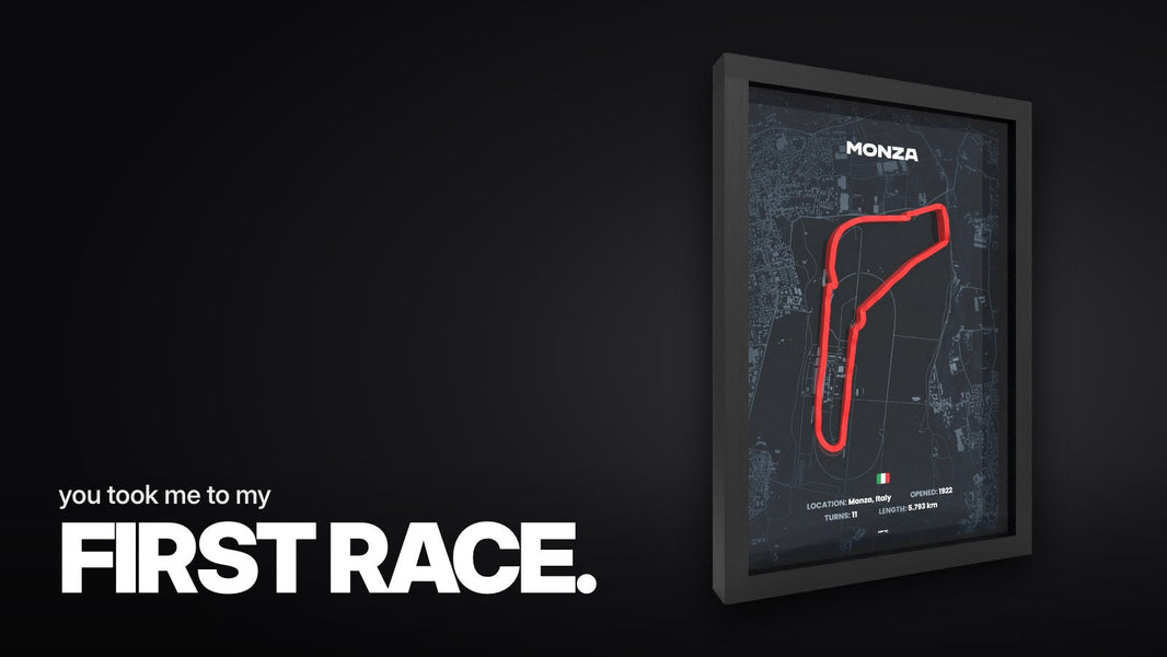 Text 'you took me to my FIRST RACE.' over the framed 3D relief of the Monza race track with a red track line on a dark map in a black frame, angled side view on a white background.