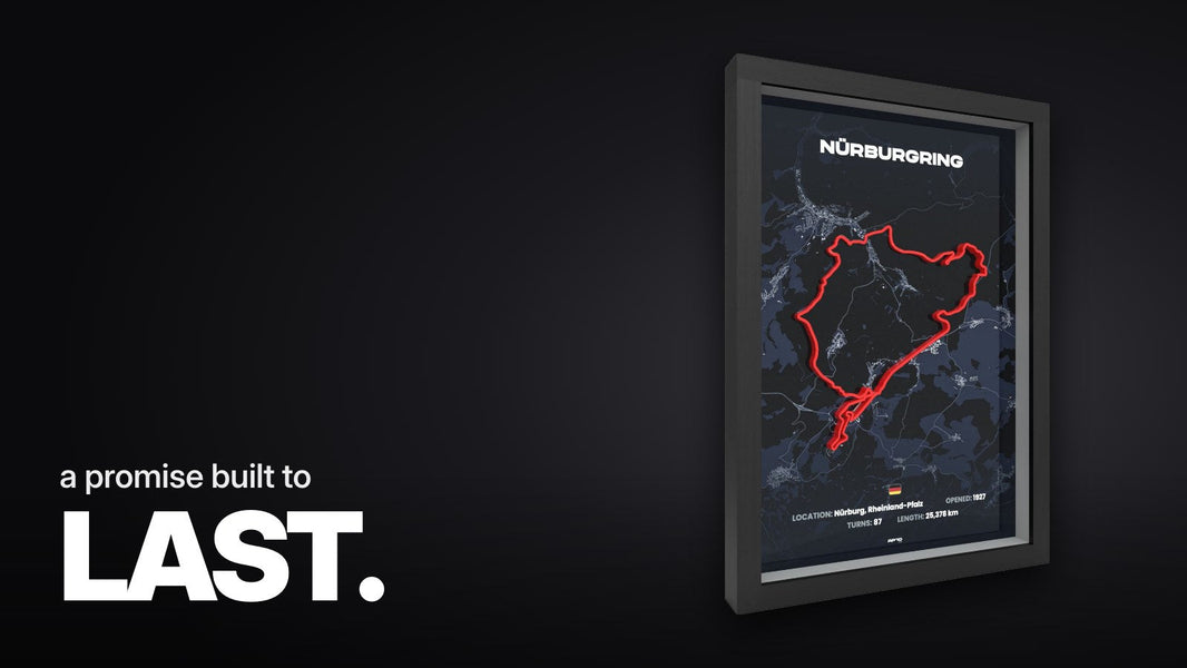 Text 'a promise built to LAST.' above the black 3D frame with the red Nürburgring Nordschleife track line on a dark blue map in an angled view.