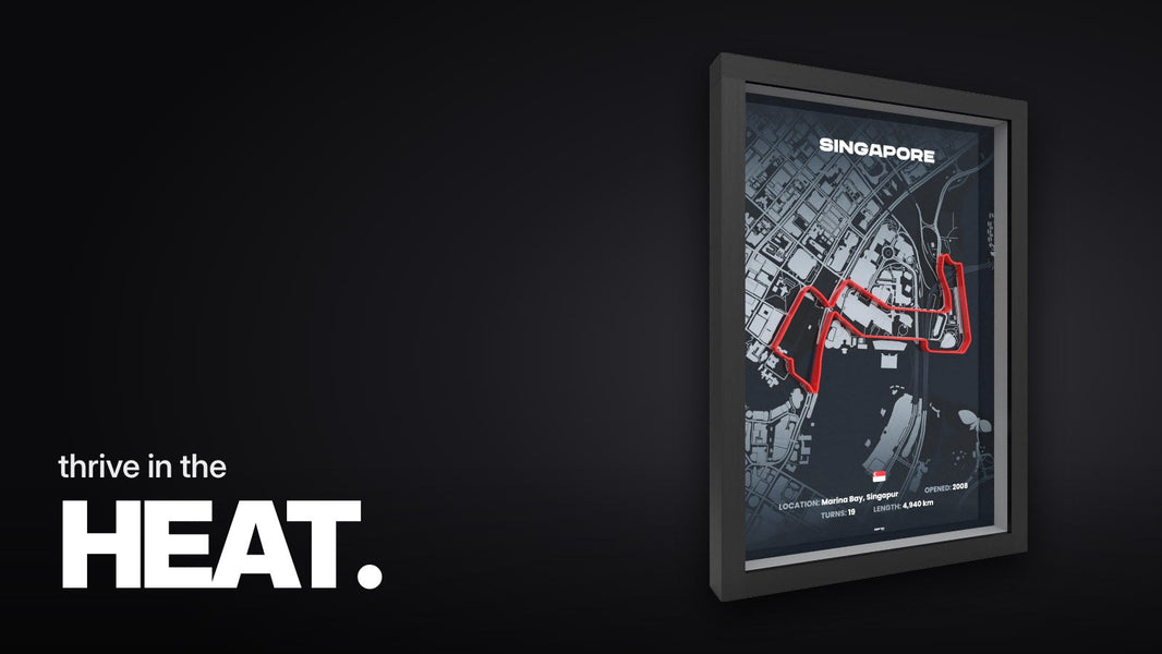 Text 'thrive in the HEAT.' above the 3D frame of the Singapore race track with a raised red track on a dark city map in a black frame, angled on a white background.