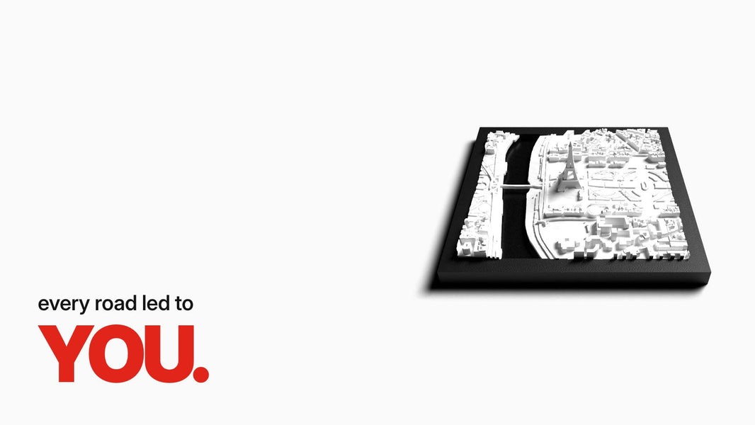 Text 'every road led to YOU.' above the City Tile Paris in an angled view, featuring the Eiffel Tower, Seine, and city blocks as a white 3D relief in a black frame.